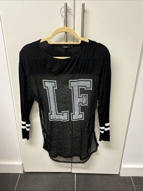 LF Black Sheer Long Sleeve Top with White Lettering and Striped Cuffs